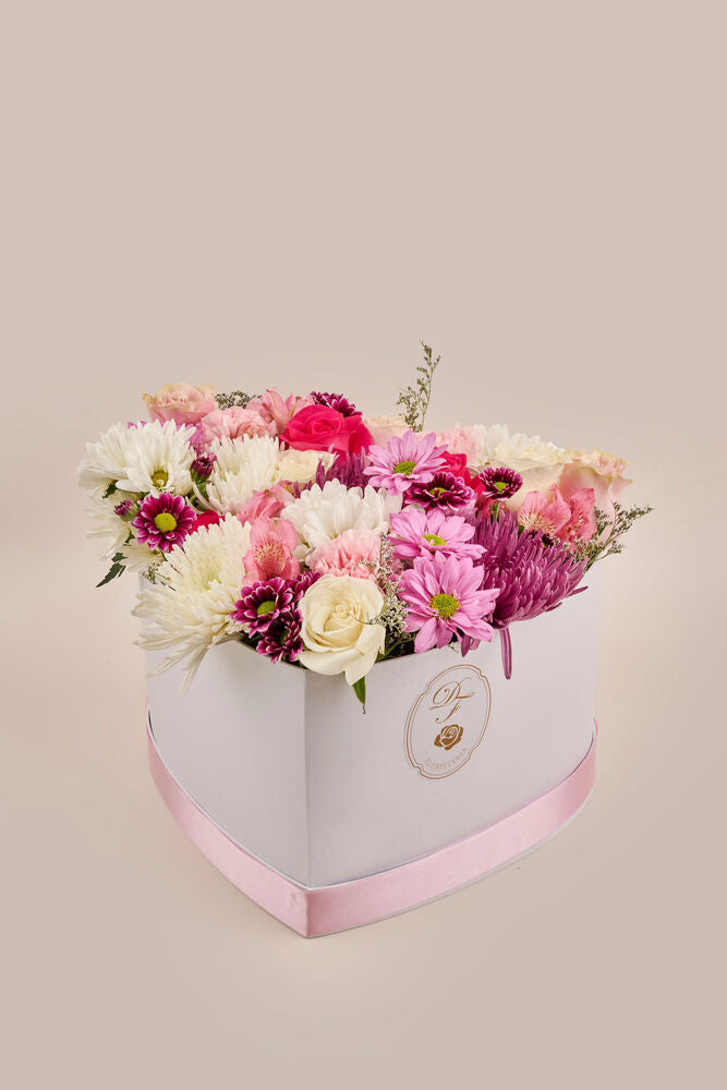 Corazón floral . (flores mixtas)
