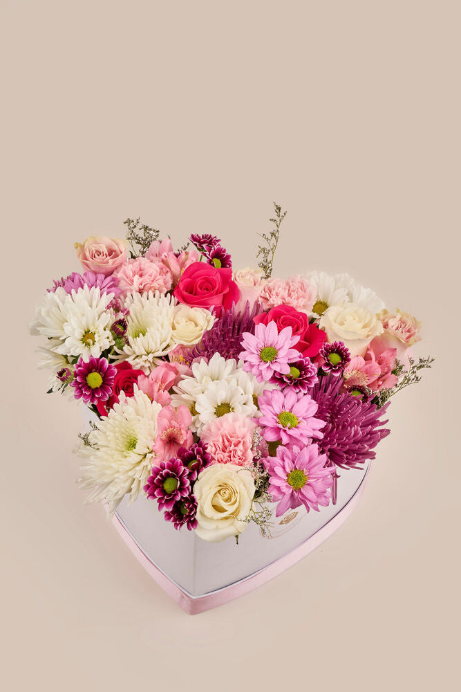 Corazón floral . (flores mixtas)