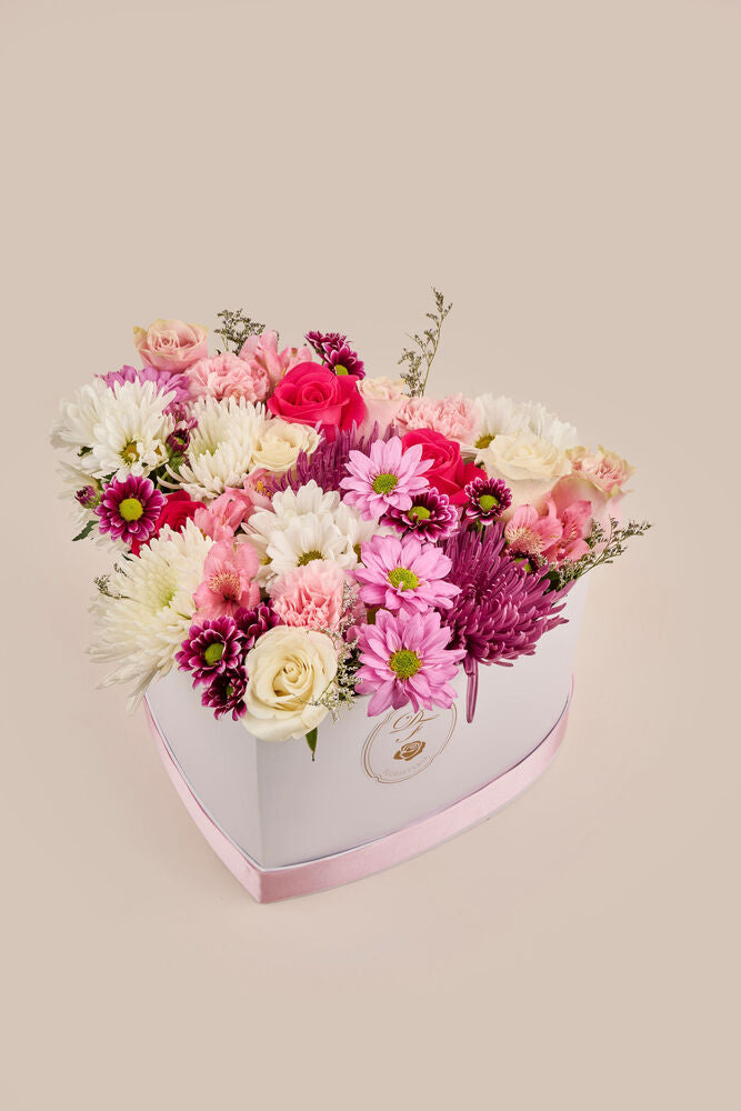 Corazón floral . (flores mixtas)